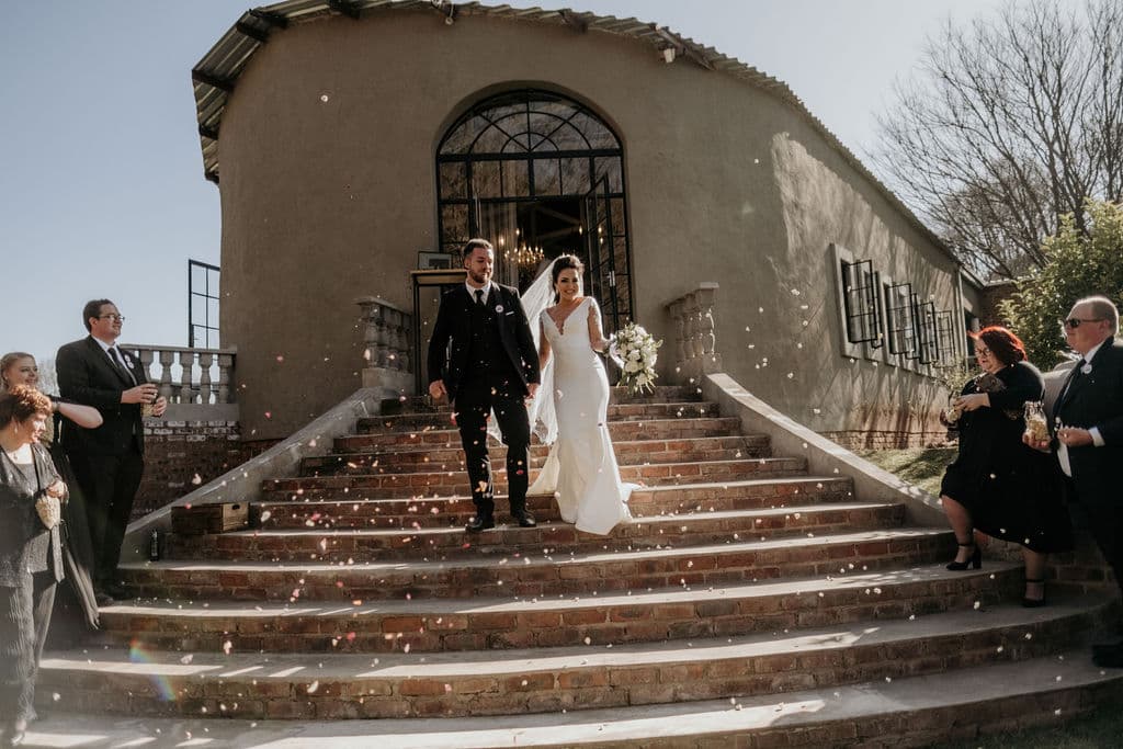 Bride against chapel window