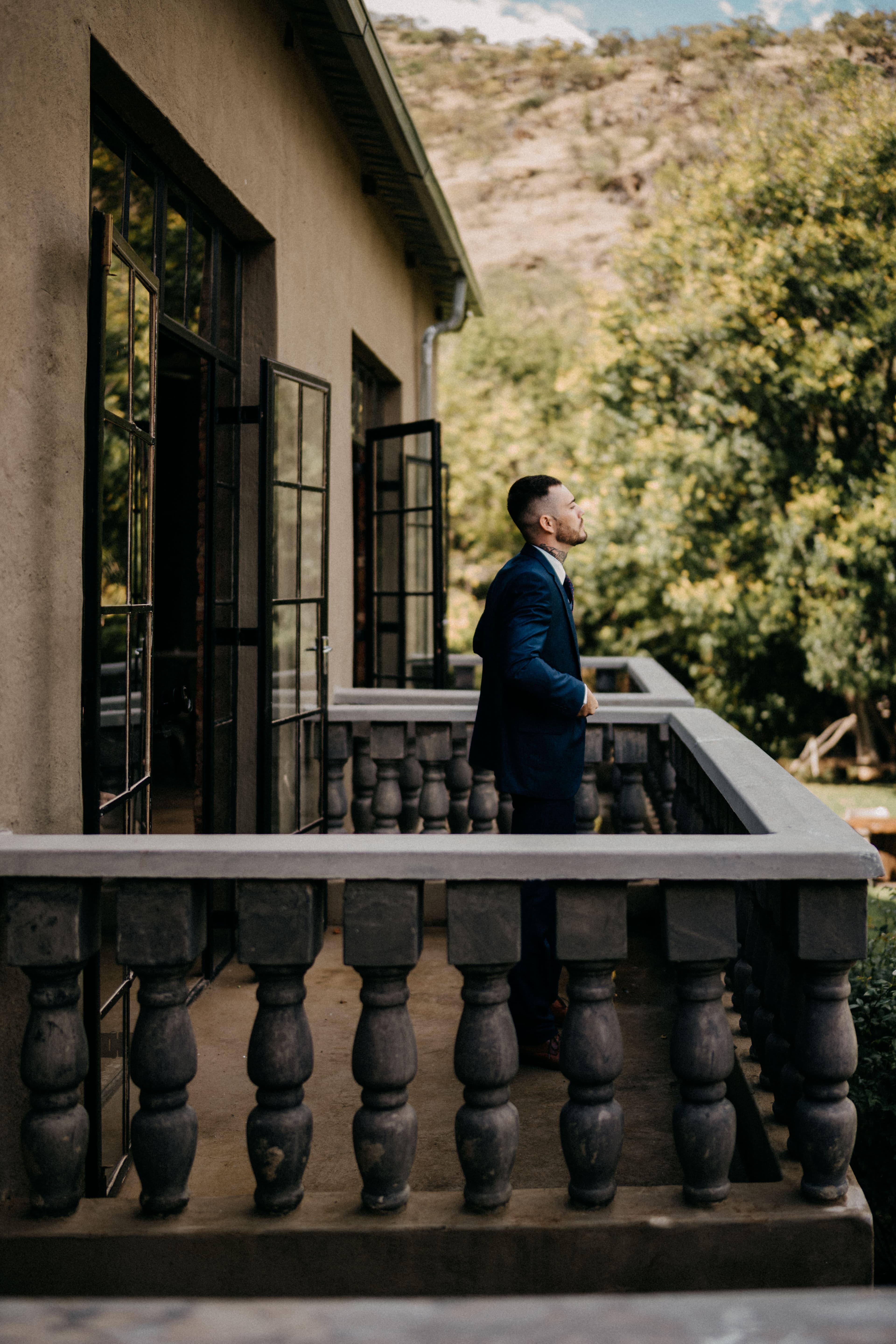 Groom on front porch