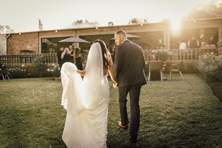 Bride and groom walking towards venue